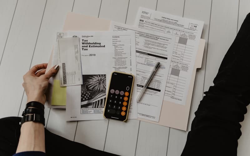 Financial documents and calculator on a desk